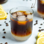 Pinterest Pin for Coffee Lemonade show a layered glass of lemonade and cold brewed coffee with ice