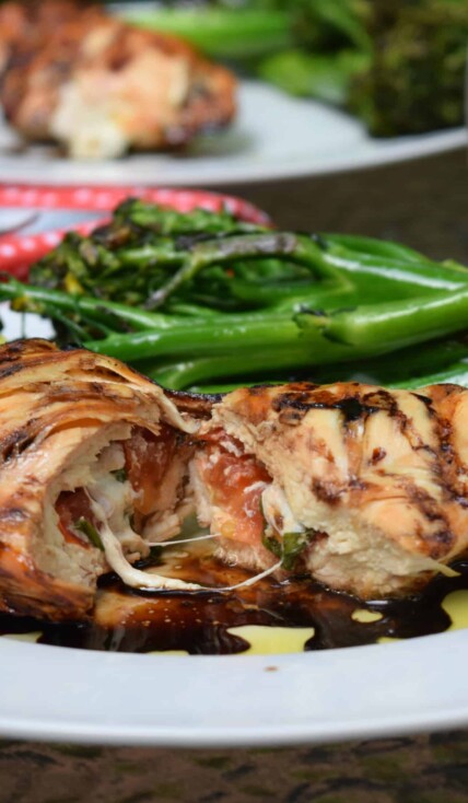 caprese chicken cut in half revealing melty cheese
