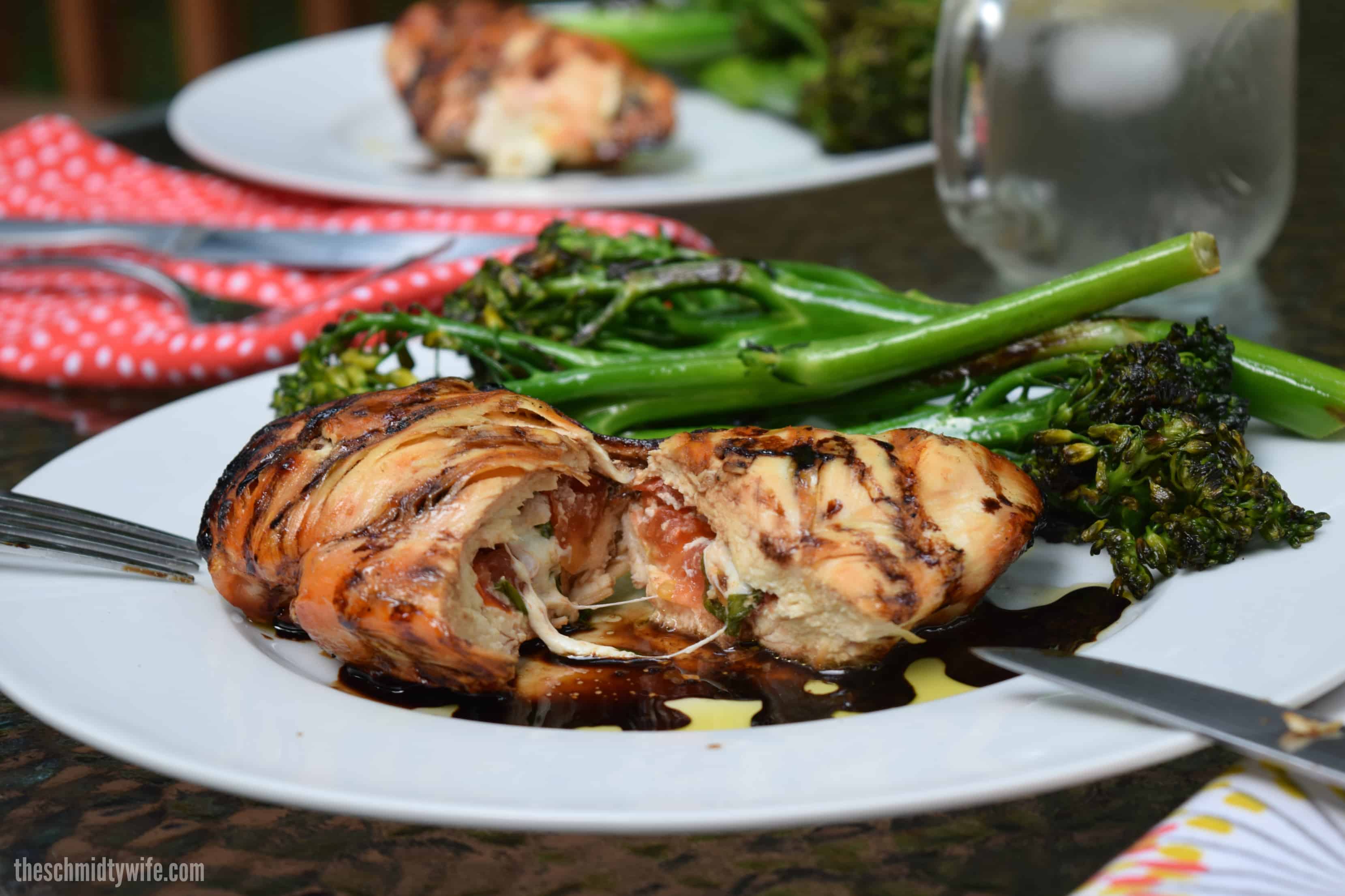 caprese chicken cut in half revealing melty cheese