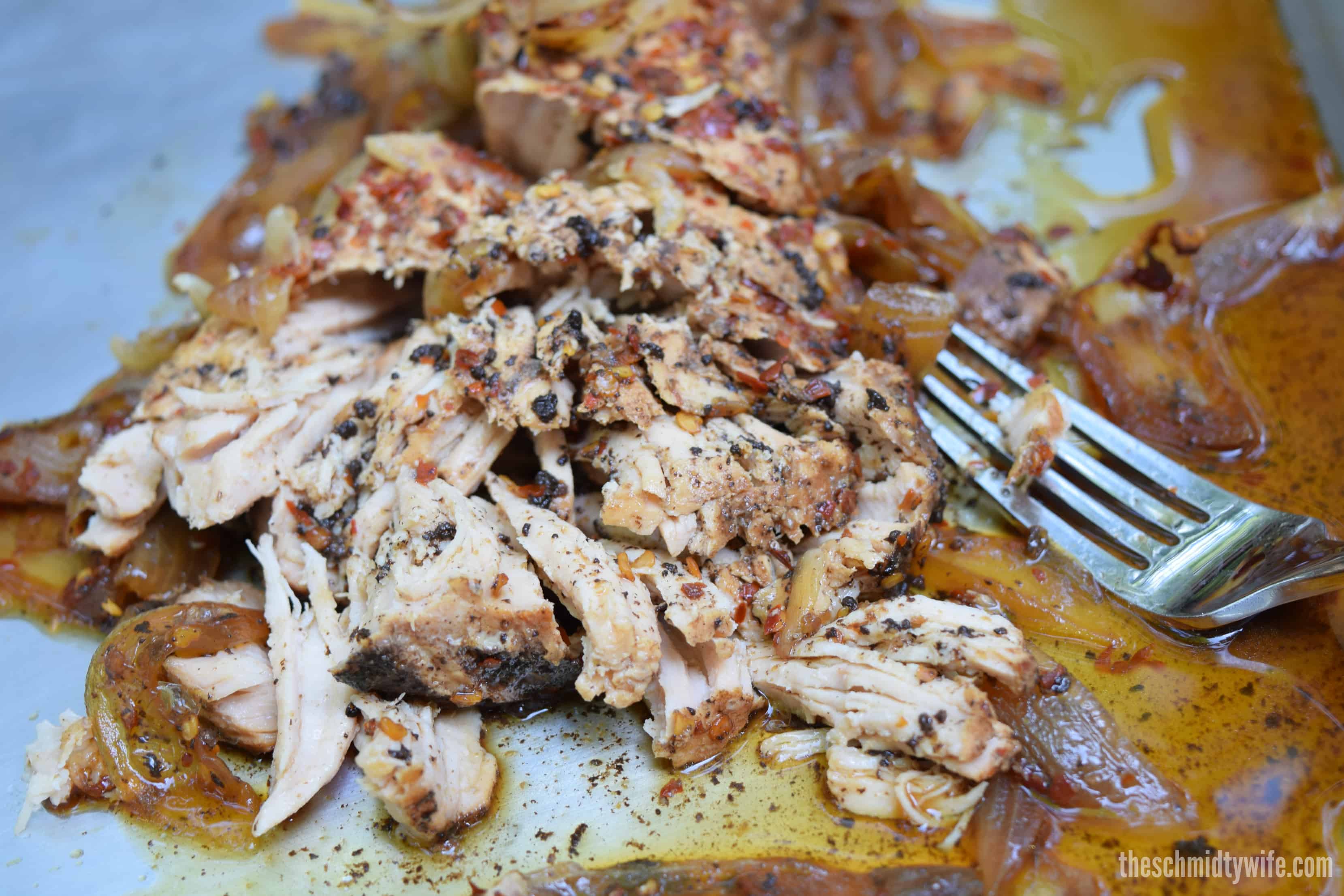 Pork Loin shredded on a sheet pan with a fork