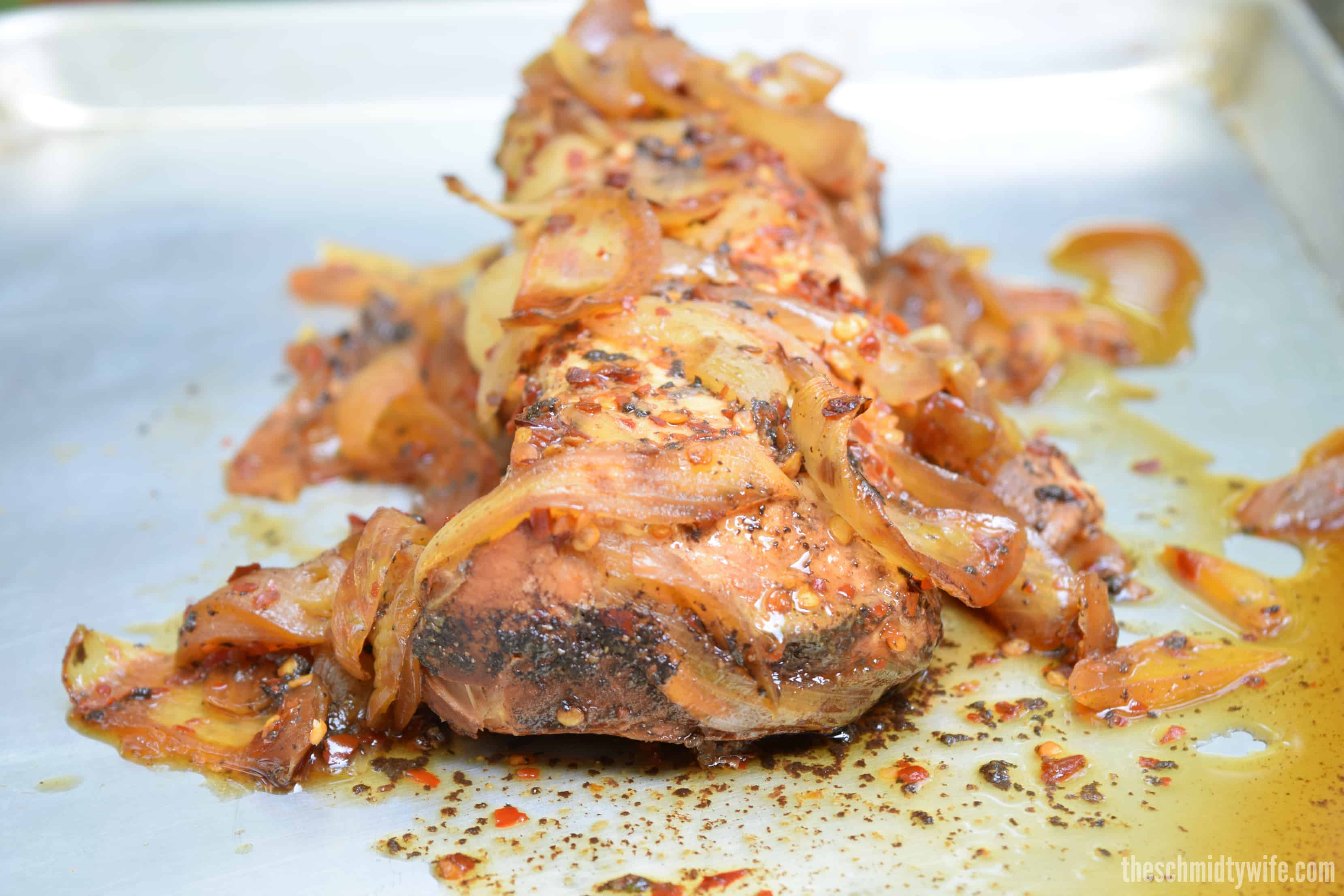 Cooked Spicy Balsamic Crockpot Pork Loin on a tray.