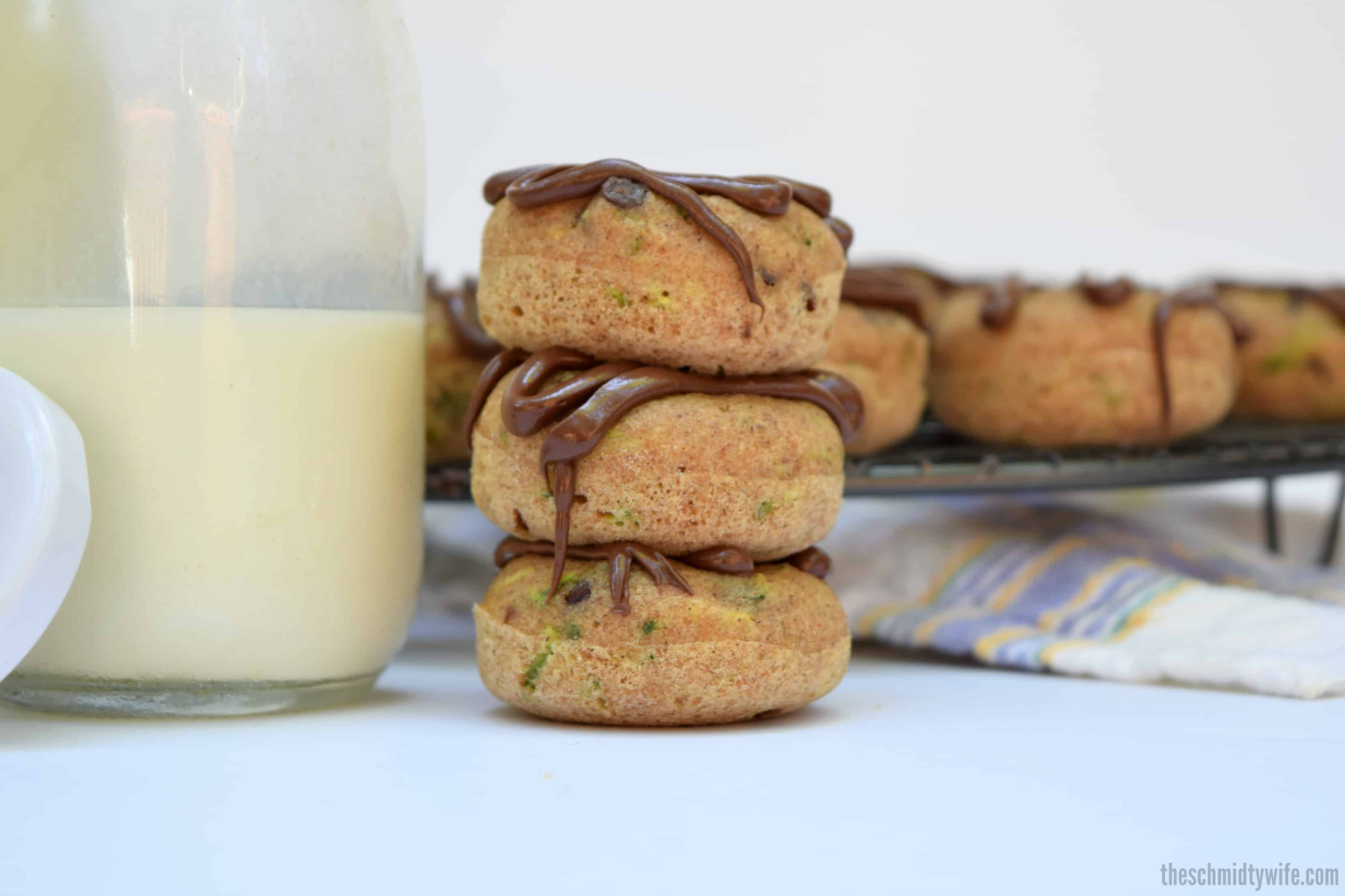 stack of 3 Zucchini Chocolate Chip Baked Donuts with milk