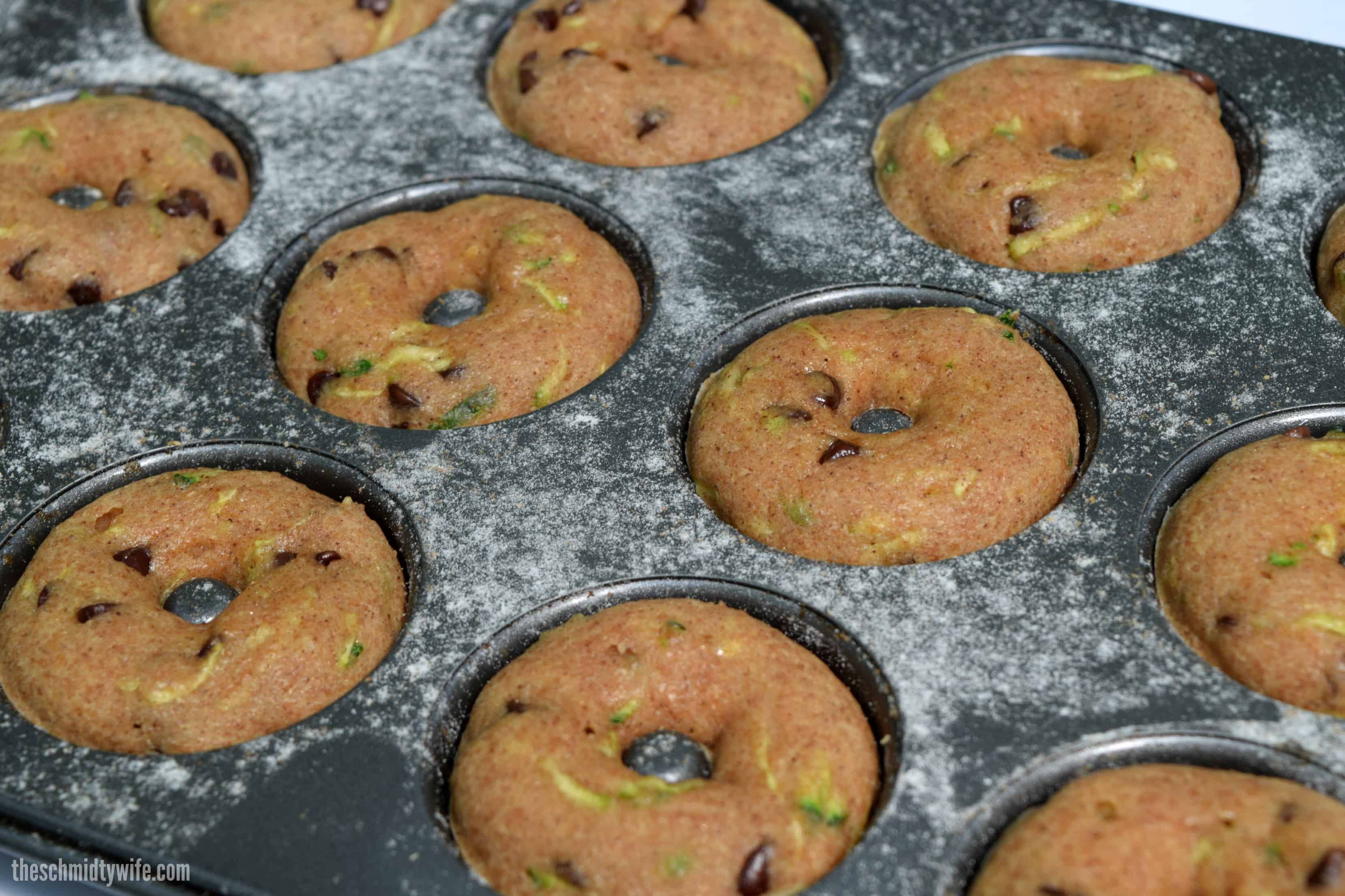 baked Zucchini Donuts in the donut tin just freshly baked out of the oven