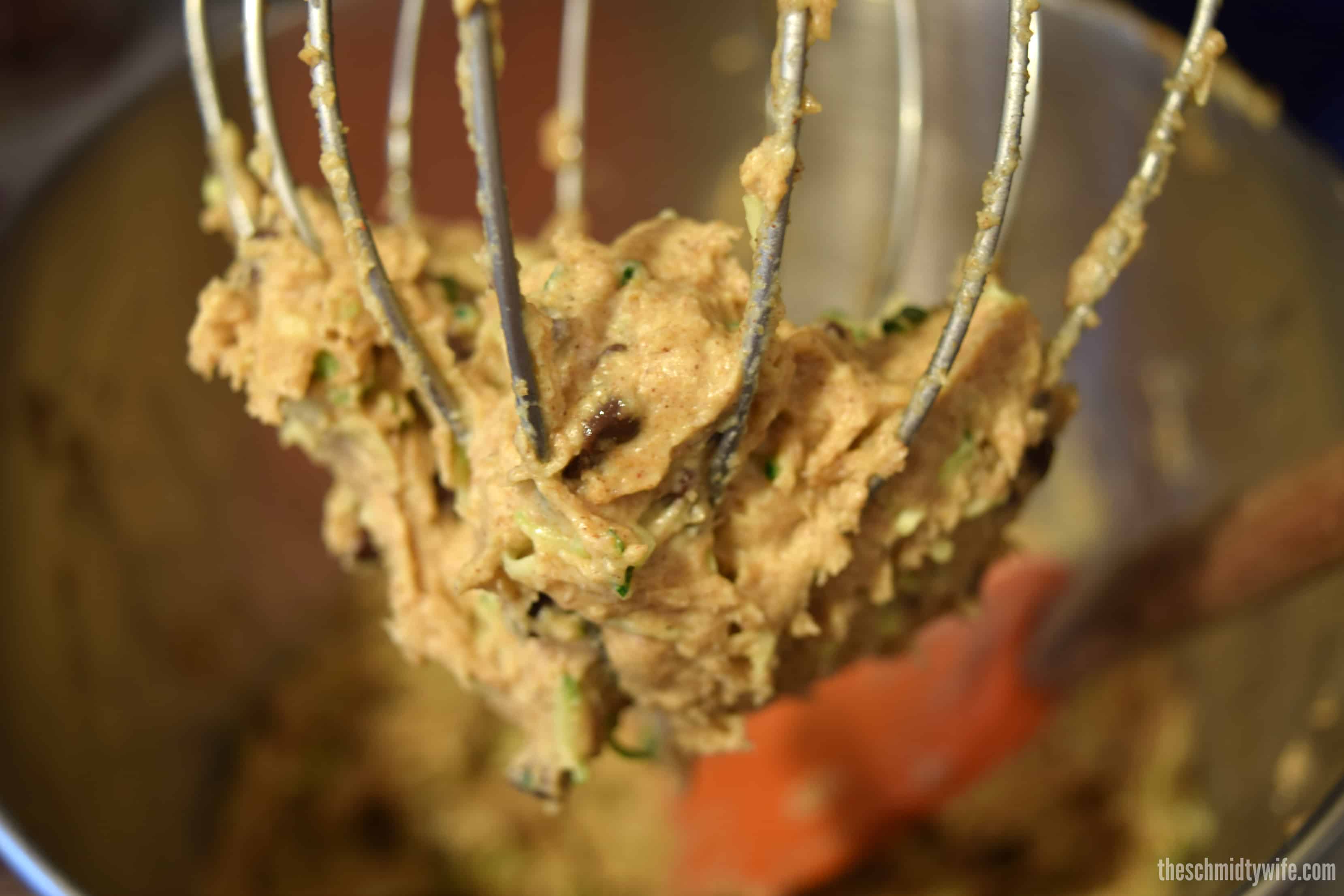 batter for zucchini donuts on a whisk 