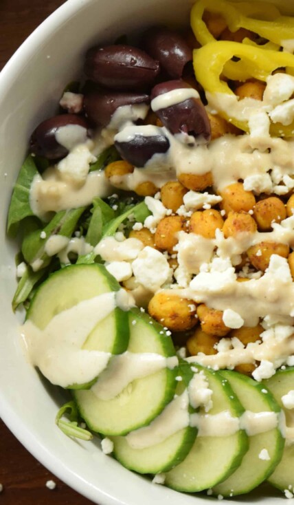 large white bowl containing a chickpea shawarma buddha bowl ready to eat