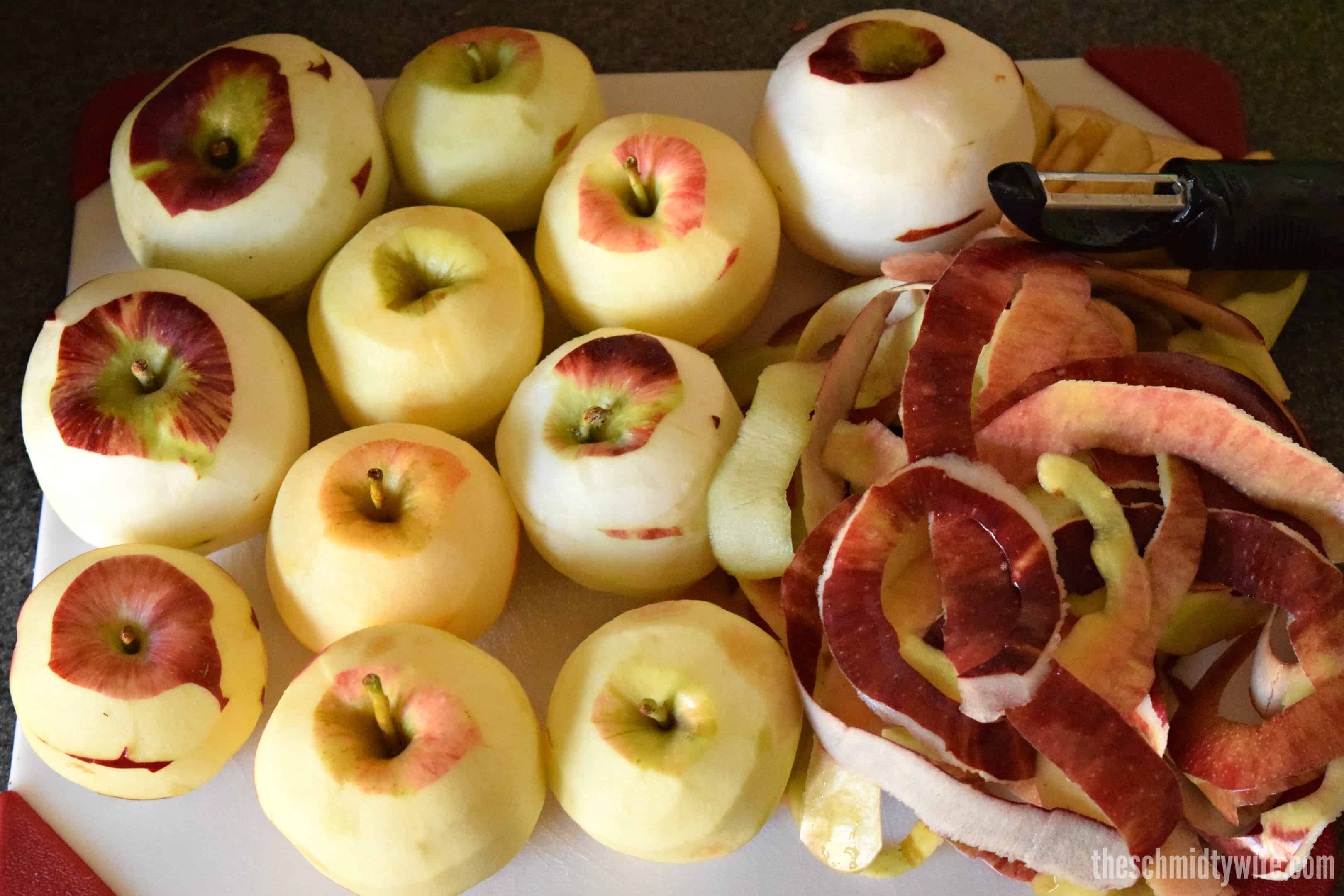 peeled apples on a cutting board