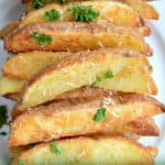 plate full of baked potato wedges