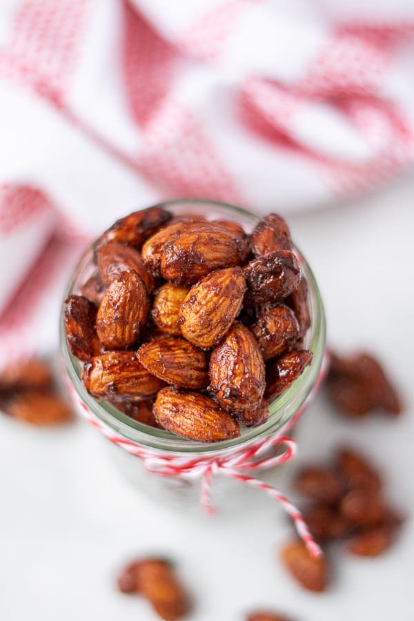 candied almonds in a jar with a red string