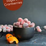 small bowl of orange sugared cranberries