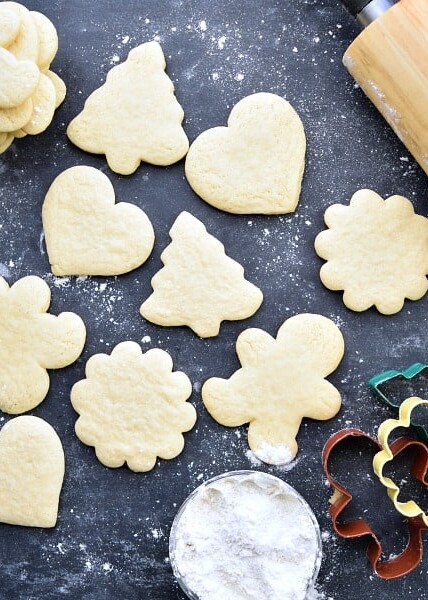 different shaped sugar cookies on a black background