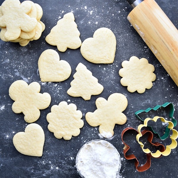 different shaped sugar cookies on a black background