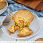 Pinterest Pin with text 'Leftover Mini Turkey Pot Pies', image with min pot pies on a white plate.
