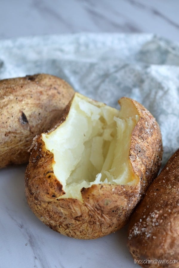 Baked Potato opened up to show fluffy white inside