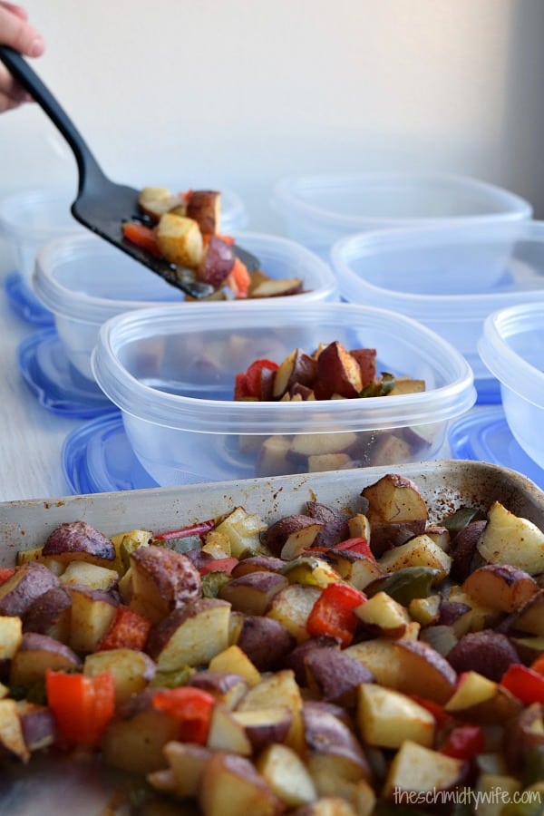 potatoes being placed into meal prep containers
