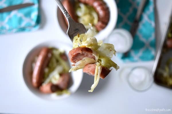 Cabbage and Chicken Sausage on a fork over a plate