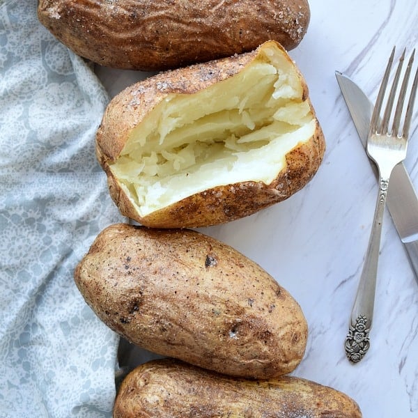 Baked Potato with a slice open showing the white insides