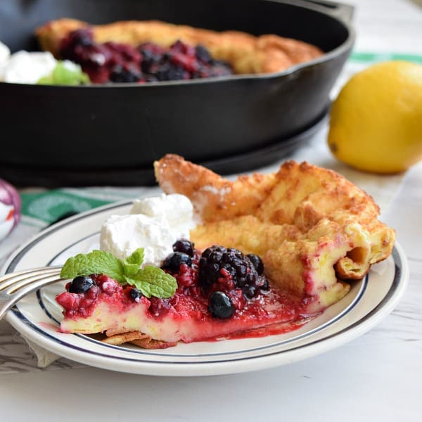 Lemon Dutch Baby with Berry Compote and Whipped Cream