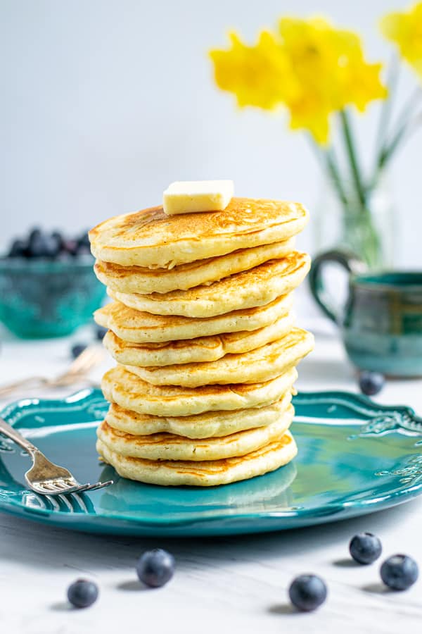 stack of homemade pancakes from scratch on a blue plate