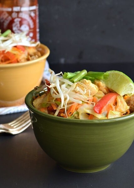 Thai Peanut Chicken with vegetables in a green bowl