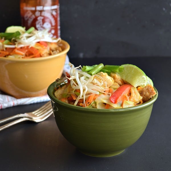 Thai Peanut Chicken with vegetables in a green bowl