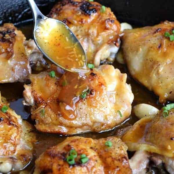 spoonful of Sticky Orange glaze on a Chicken Thigh