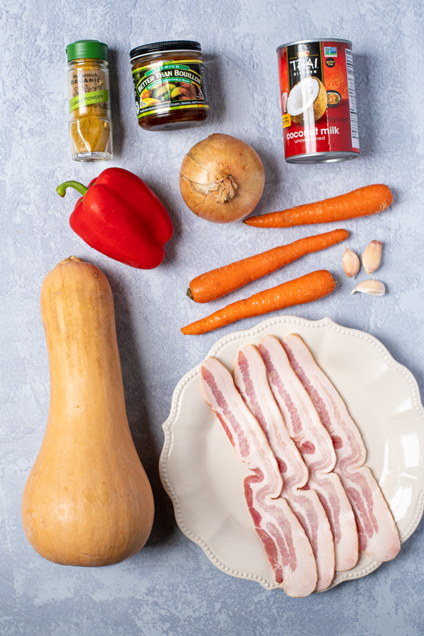 Ingredients for roasted butternut and carrot soup laid out on a table.