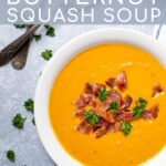 Pinterest Pin with text overlay, Roasted Butternut Squash Soup, image of a white bowl full of yellow soup garnished with bacon.