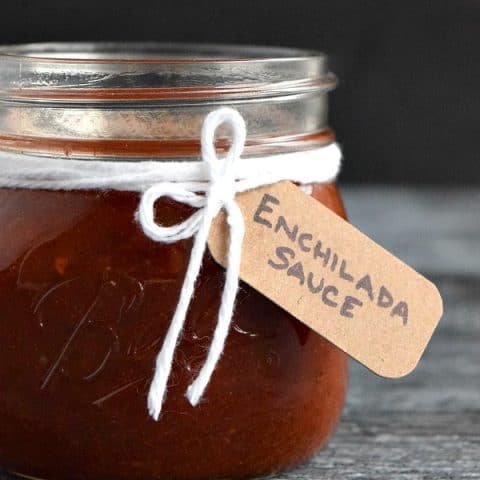 close up of enchilada sauce in jar