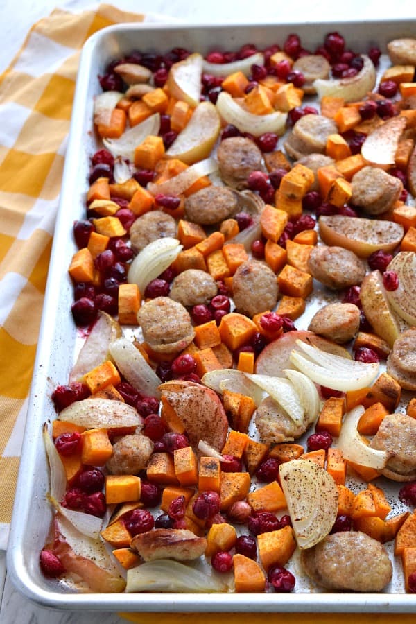 top view of tossed and cooked Close up of colorful uncooked Sheet Pan Cranberry Chicken Sausage