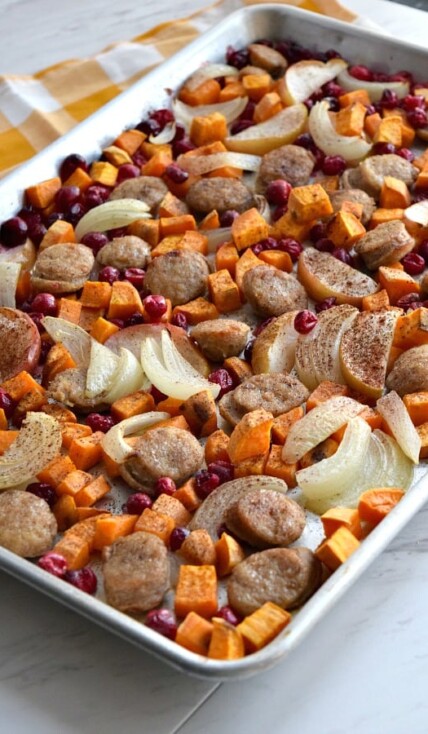side view of cooked Close up of colorful uncooked Sheet Pan Cranberry Chicken Sausage