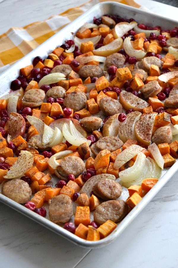 side view of cooked Close up of colorful uncooked Sheet Pan Cranberry Chicken Sausage