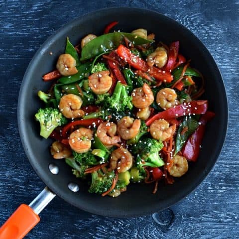 overhead view of shrimp stir fry in skillet