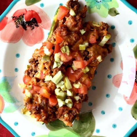 close up of Bacon Cheeseburger Zucchini Boats on a plate