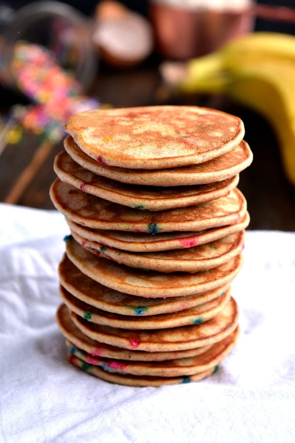 A tall stack of Mini Whole Wheat Banana Pancakes