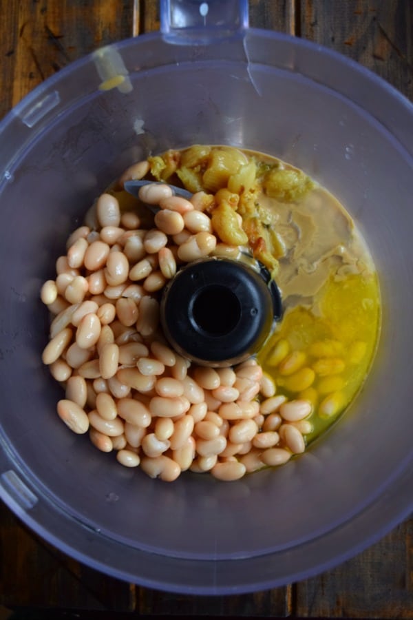 white beans, roasted garlic, olive oil, and tahini in a food processor
