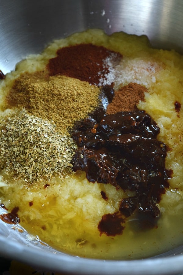 Ingredients for Slow Cooker Chipotle Pineapple Carnitas in bowl ready to be mixed and poured over the pork