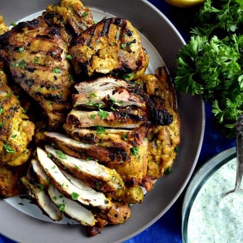 Grilled Chicken Shawarma Sliced on a plate ready to be added to a pita