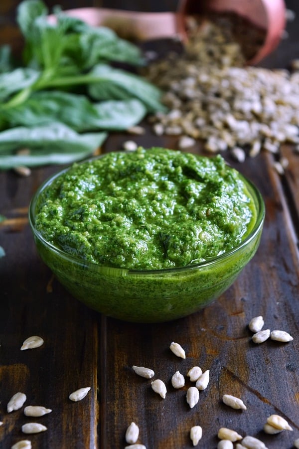 bright green Sunflower Seed Basil Pesto in a small bowl 