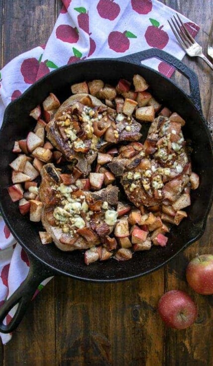 Overhead Shot of Apple Bacon Blue Smothered Pork Chops in a cast iron skillet