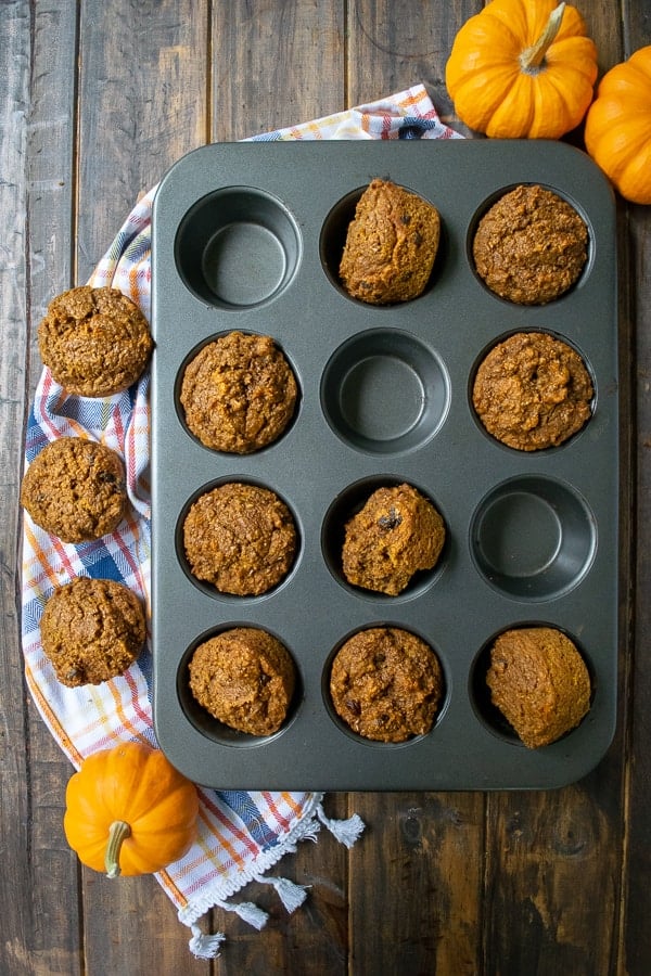 A muffin tin full of pumpkin bran muffins