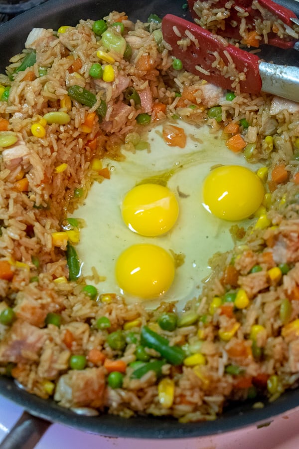 The eggs in the hole to be scrambled into the fried rice