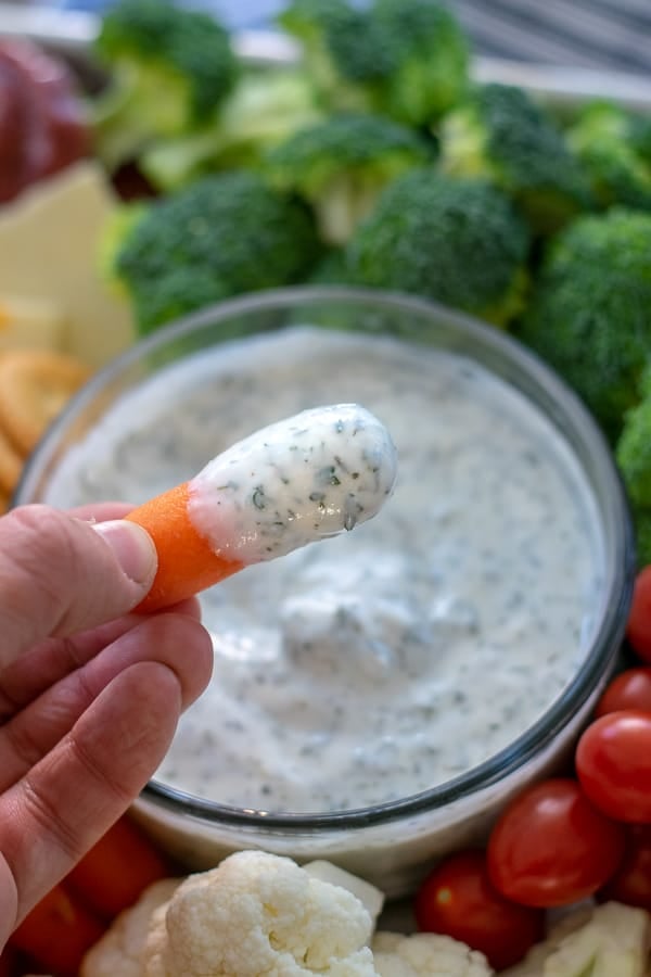 a carrot with ranch dip