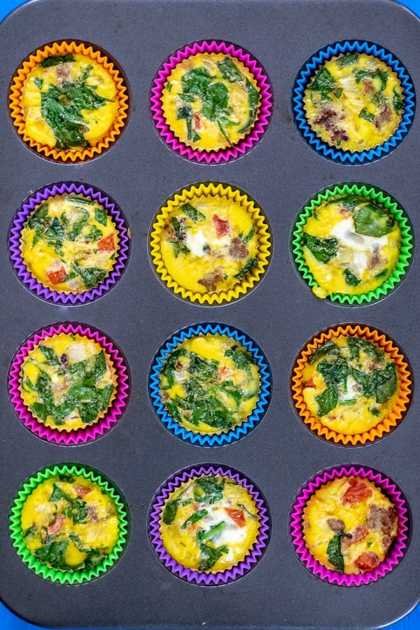 Double Batch Meal Prep Spinach Sausage Egg Muffins in a muffin tin