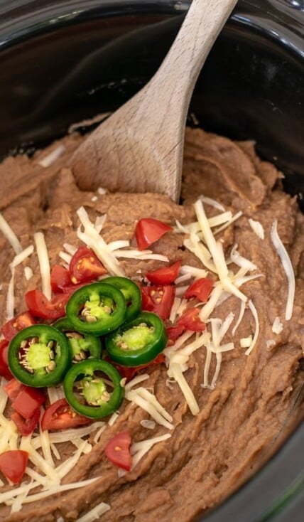 cooked refried beens sitting in the crockpot