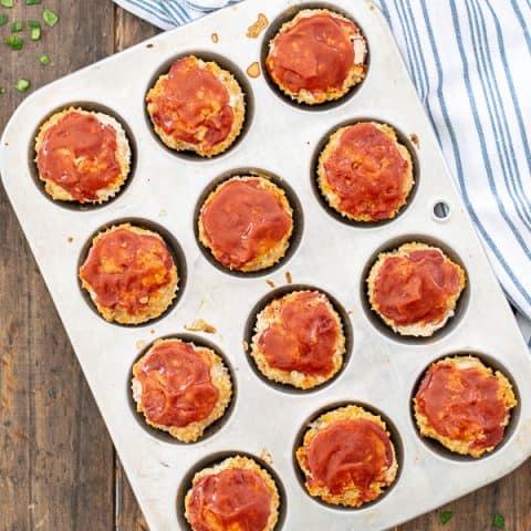 a muffin tin full of turkey veggie meatloaf