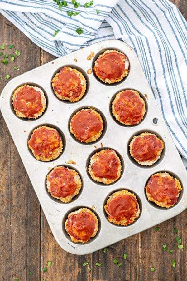 a muffin tin full of turkey veggie meatloaf
