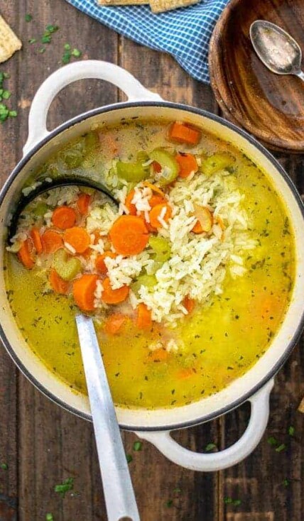 carrots, celery, and rice in a soup pot