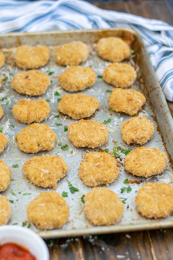 sheet pan full of baked chicken nuggets