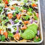 a recipe for seasoned black bean nachos, ready in 10 minutes on a sheet pan
