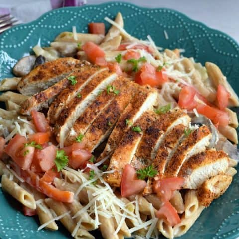 a plate full of cajun chicken pasta